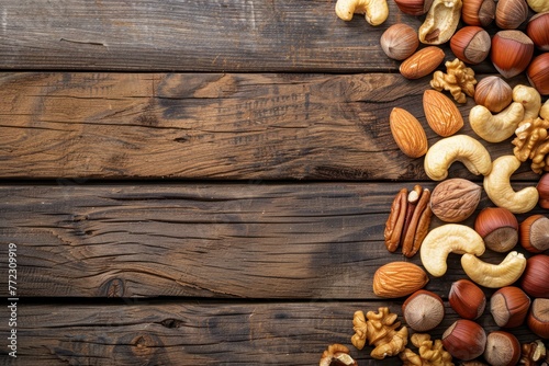 Assorted Nuts on Wooden Background. A nutritious assortment of almonds