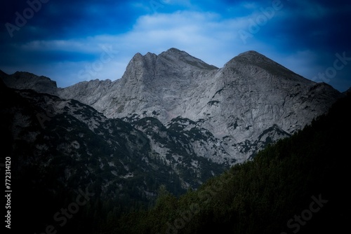 Stunning aerial shot of the majestic Alps, featuring a beautiful mountain range