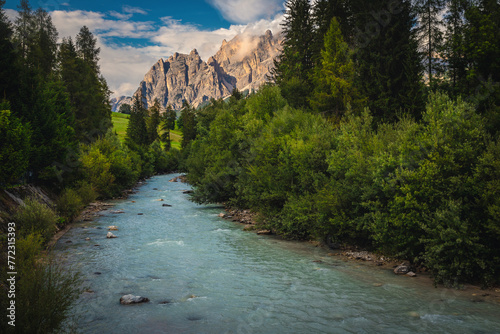 Boite river and high mountains at sunset, Dolomites, Italy