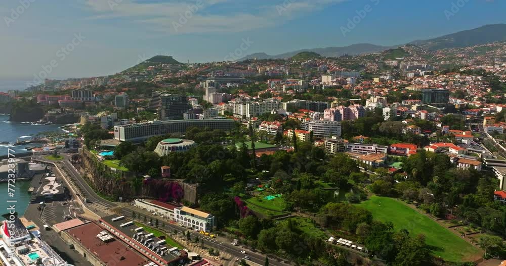 Incredible drone view of the sunny tourist city of Funchal, the capital of the island of Madeira, Portugal. A tourist island where cruise ships call and a large number of tourists come all year round Incredible drone view of the sunny tourist city of Funchal, the capital of the island of Madeira, Portugal. A tourist island where cruise ships call and a large number of tourists come all year round