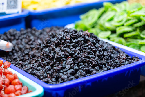 Colourful blackberry fruits for sale on display at trade fair. photo