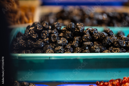 Colourful blackberry fruits for sale on display at trade fair. photo