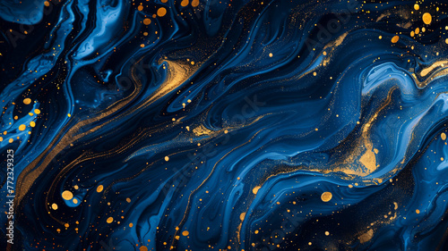 Splashes of blue and gold paint adorn an abstract liquid backdrop created digitally. photo