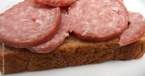 bread with salami. snack made with salami and bread. meal details.