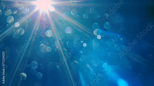 lens flare, sommer sun, blue background, copy and text space, 16:9 © Christian