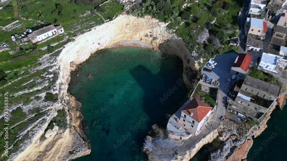Greece  Peloponnese - Chalikia Beach , Mezapos ,  Mani.  Small fishing port and an interesting beach between two high cliffs - drone aerial view Mediterranean coast with clear sea water 