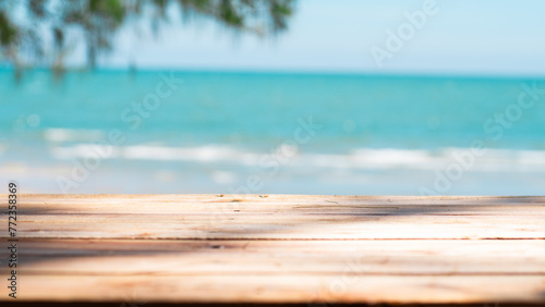 Fototapeta Naklejka Na Ścianę i Meble -  Summer product display on wooden podium at sea tropical beach
 Mock up for product display. 3D render.  Holiday summer beach background
