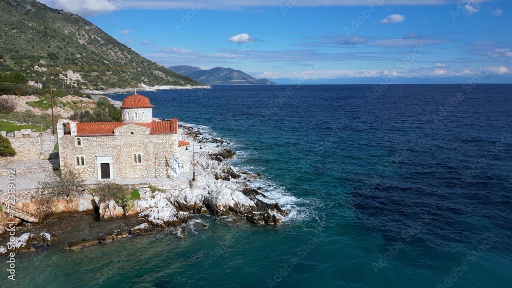 Church by the sea in the beauty of nature and the sea coast of the Peloponnese, Mani Lakonia - uncontaminated nature and blue sea where you can spend your summer holidays - drone aerial view