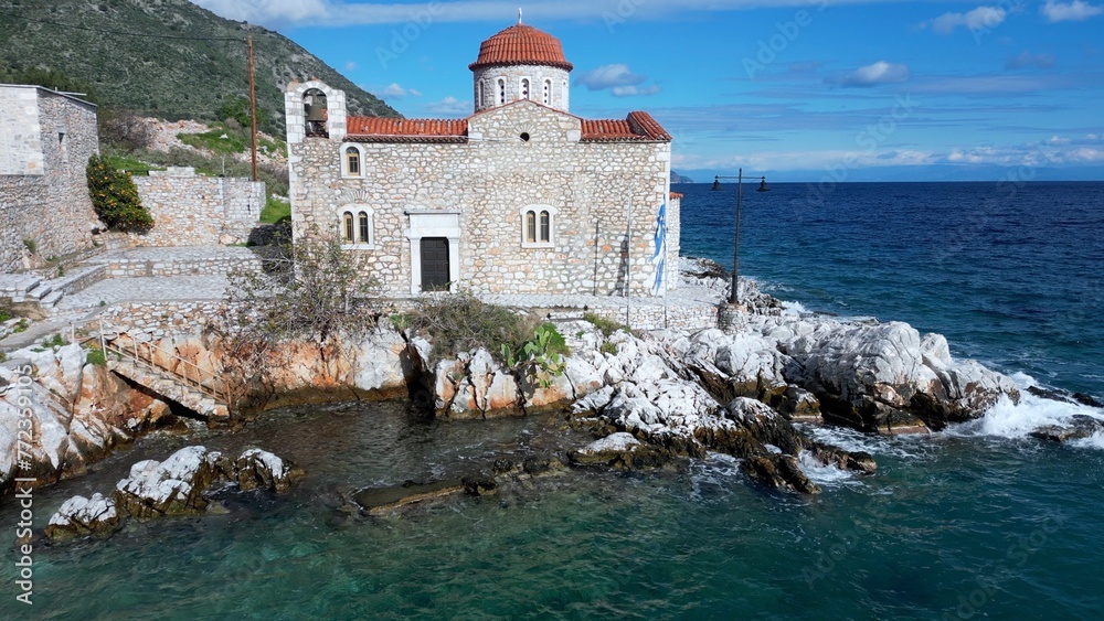 Church by the sea in the beauty of nature and the sea coast of the Peloponnese, Mani Lakonia - uncontaminated nature and blue sea where you can spend your summer holidays - drone aerial view
