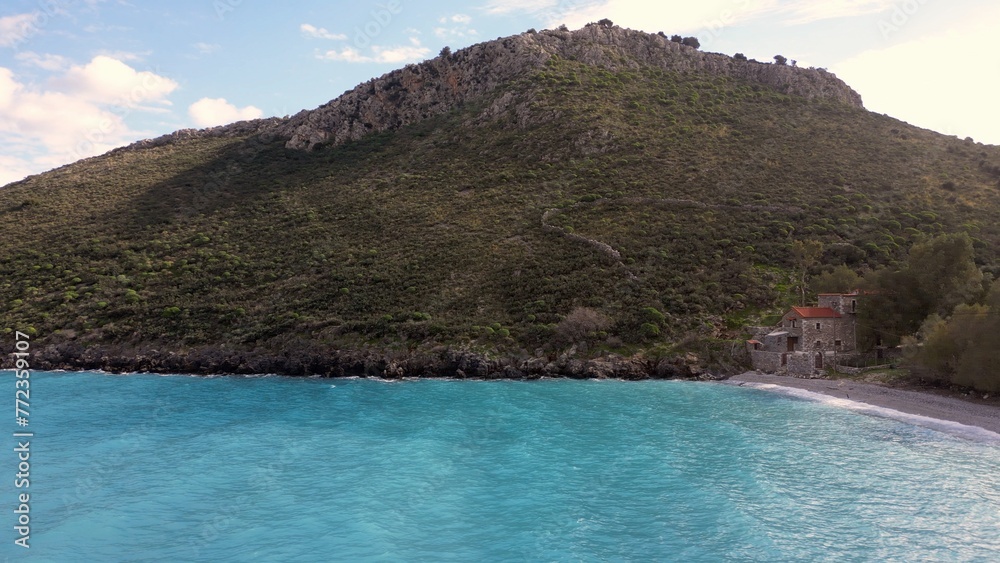 Beautiful turquoise blue water in the Mediterranean Sea in Greece Pelopponese - the splendor of the clear and warm waters of the sea where to spend summer holidays - drone aerial view of wild coast