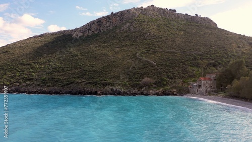 Beautiful turquoise blue water in the Mediterranean Sea in Greece Pelopponese - the splendor of the clear and warm waters of the sea where to spend summer holidays - drone aerial view of wild coast  photo