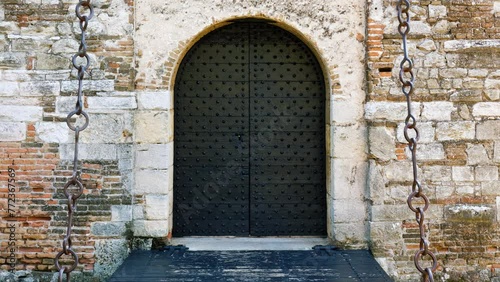 Main entrance to the medieval castle of Soave, Italy, with its drawbridge over a moat