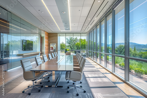 Sleek boardroom with floor-to-ceiling windows presenting a stunning view of a mountain range  complete with modern furnishings.