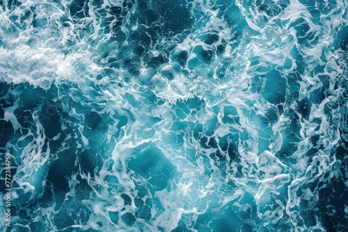 Background of blue sea water with foam and waves