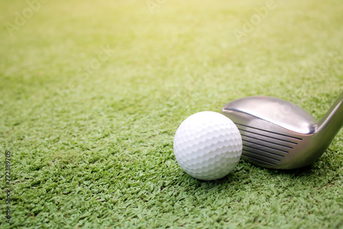 Golf ball placed on artificial grass.