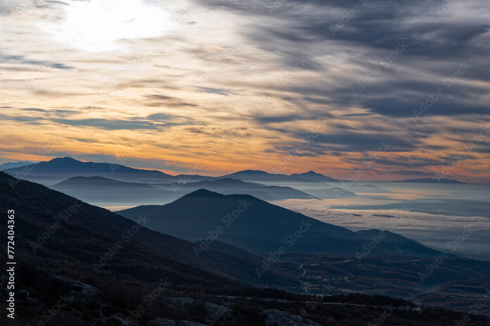 Mountain landscape with sunset on Mount Gramos near the city of Kastoria in Macedonia, Greece Mountain landscape with sunset on Mount Gramos near the city of Kastoria in Macedonia, Greece