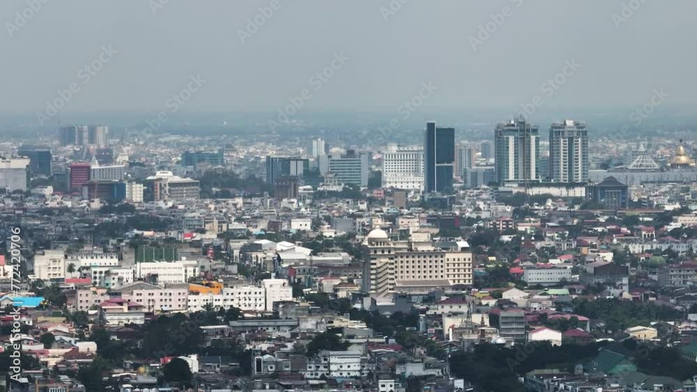Aerial view of Medan city with residential areas and houses. Sumatra, Indonesia. Aerial view of Medan city with residential areas and houses. Sumatra, Indonesia.