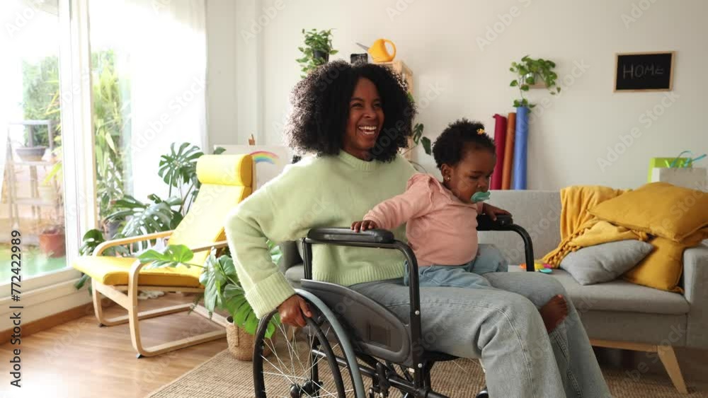 African American mother in a wheelchair with her baby. African American mother in a wheelchair with her baby.