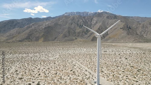4K Aerials of the windmill farm in Palm Springs, California at the foot of the San Jacinto Mountains, adjacent to Highway 111, which helps provide energy for the Coachella Valley in Riverside County.