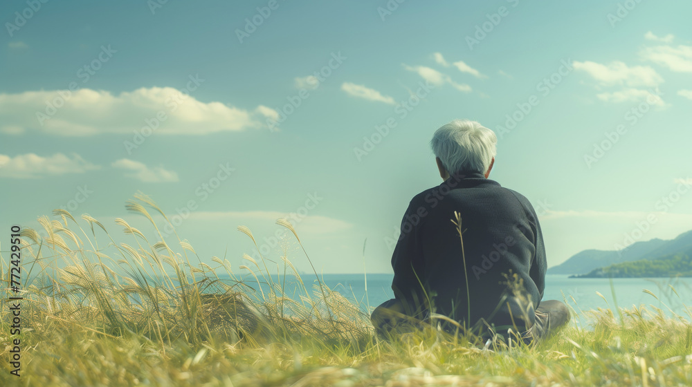 Elderly man looking at the sea with copy space Elderly man looking at the sea with copy space