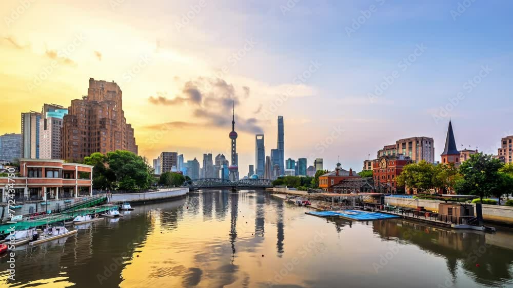 Time lapse of Shanghai modern downtown buildings and river at sunrise Time lapse of Shanghai modern downtown buildings and river at sunrise