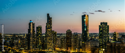 Drone view of a of a panoramic of the downtown Chicago city skyline during dusk time 