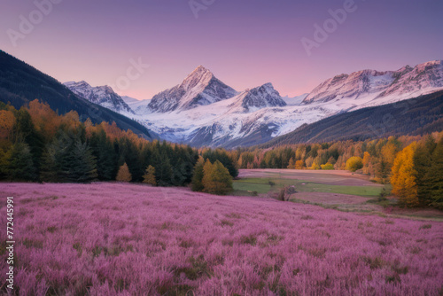 Majestic sunrise paints the alpine peaks with vibrant colors, casting long shadows across the green valley below
