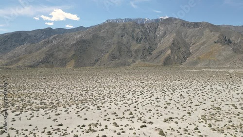 4K Aerials of the windmill farm in Palm Springs, California at the foot of the San Jacinto Mountains, adjacent to Highway 111, which helps provide energy for the Coachella Valley in Riverside County.