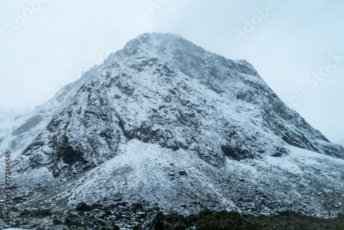 Photograph of snow on a large mountain range in Fiordland National Park on the South Island of New Zealand