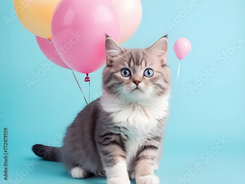 Whimsical Whiskers. A Playful Feline Poses with Pastel Balloon in Studio Snap. © Francesco 