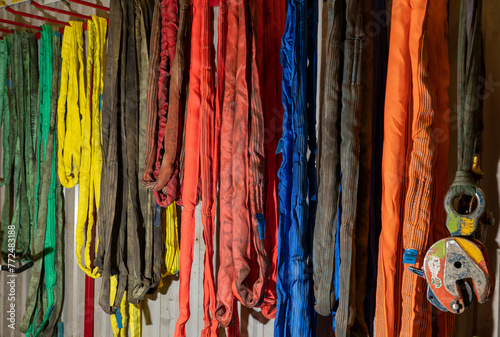 Slings of different colors for lifting loads.