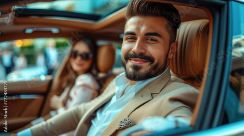 Confident businessman with a stylish woman in a luxury car. photo