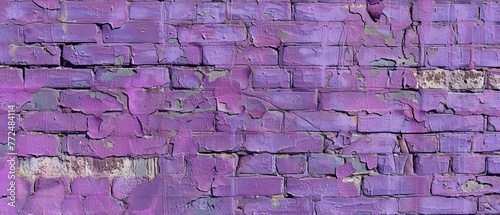 Wide shot of a purple brick wall with visible damage and decay  a stark reminder of nature s wear on manmade structures.