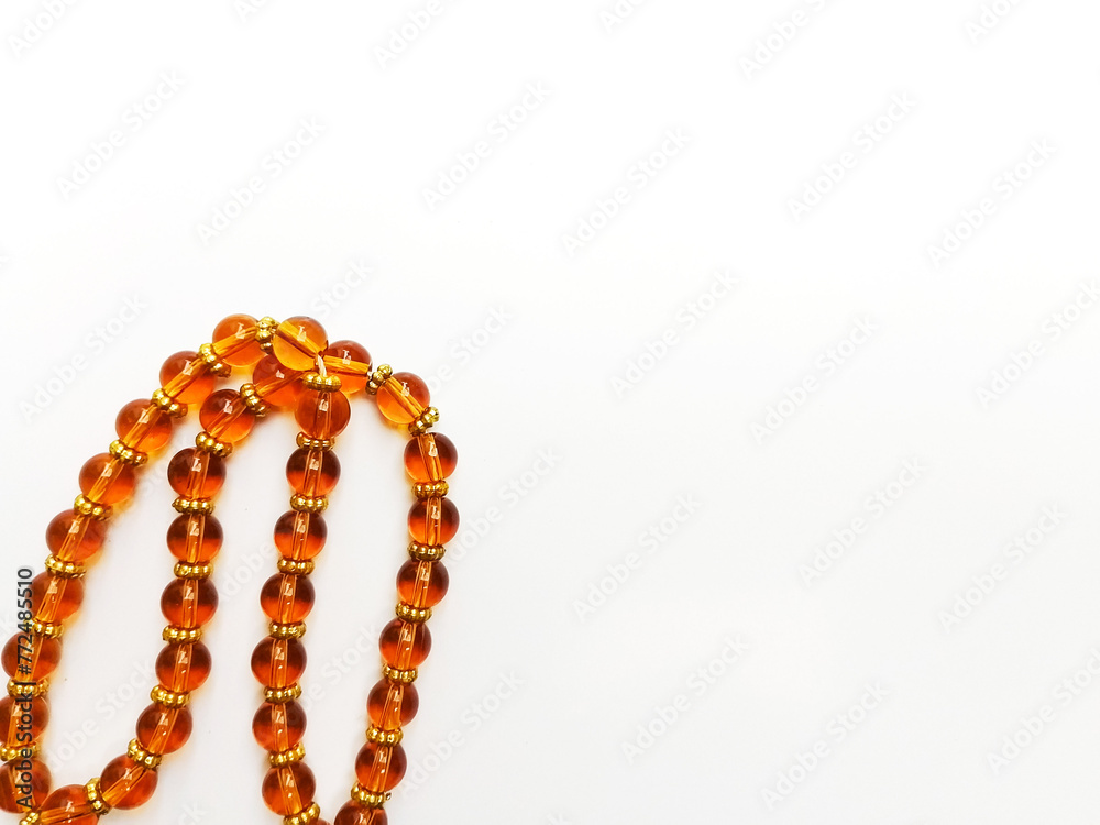 Orange Tasbih - Muslim Prayer Beads isolated on white background Orange Tasbih - Muslim Prayer Beads isolated on white background
