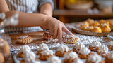 Child's hand decorating cookies
