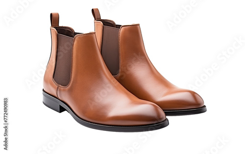 A pair of brown chelsea boots elegantly displayed on a white background