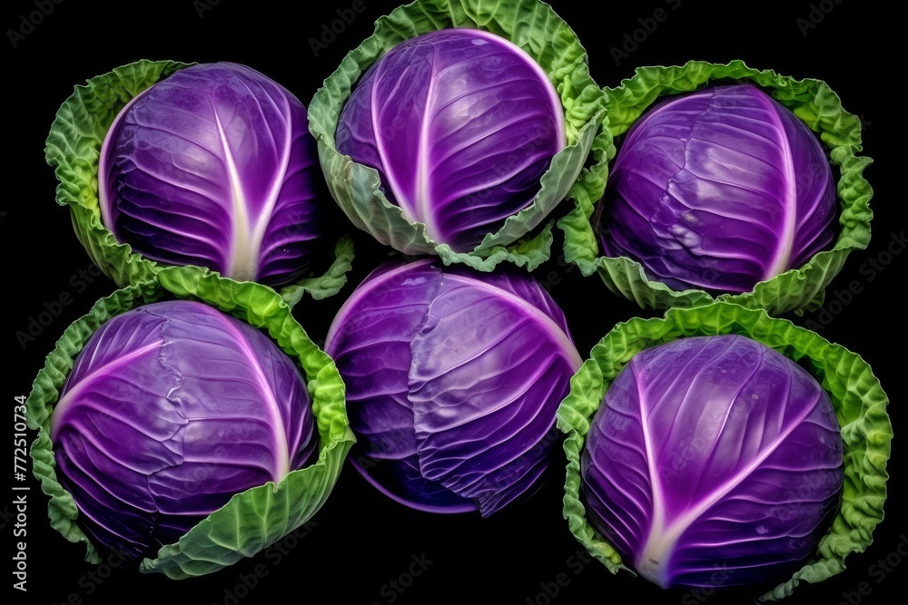 Fototapeta premium Fresh purple cabbage isolated on black background with clipping path for designers and food bloggers