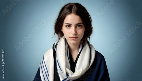 a young woman wearing a blue and white scarf, tallit photo