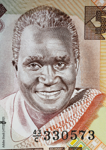 Portrait of former president Kenneth Kaunda on Zambia 5 Kwacha currency banknote (focus on center)