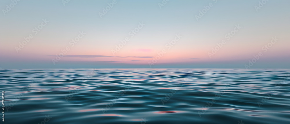 Soft waves of the ocean under a gradient sunset sky from pink to blue, evoking calm and peace