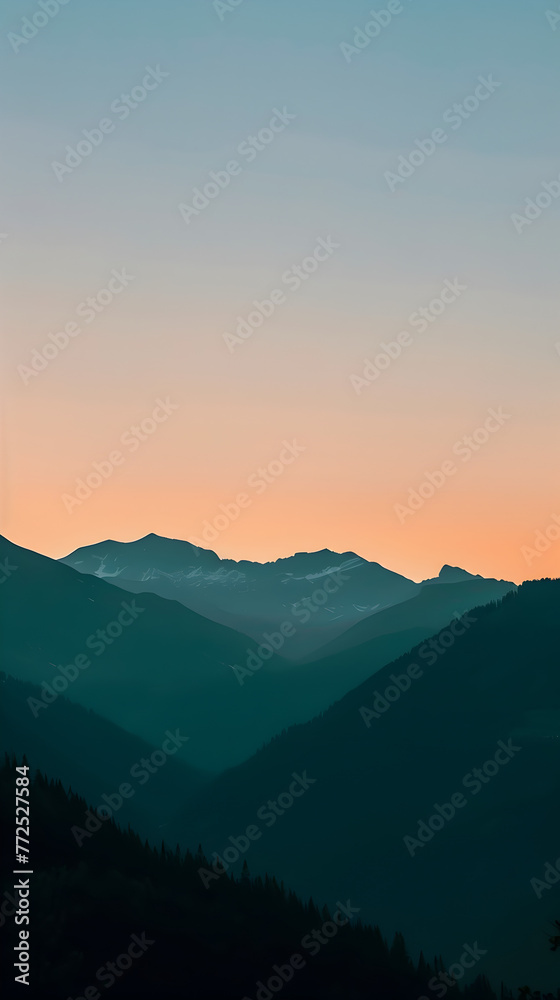 The horizon shows a stunning contrast of orange and blue hues with mountain peaks at twilight