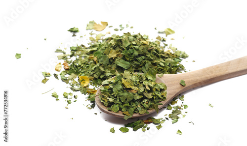 Organic Moringa green tea in wooden spoon isolated on white