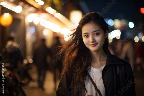 Portrait of beautiful young Asian female on the city street in Tokyo