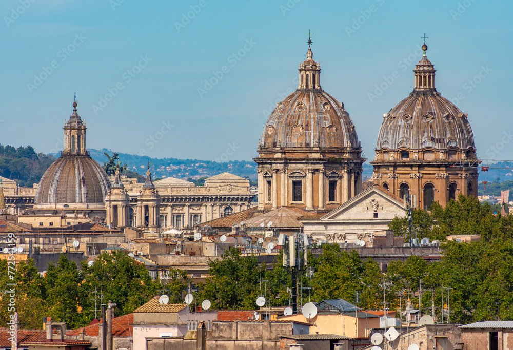 Rome cityscape with church domes seen from Aventine hill, Italy