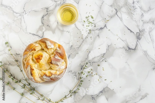 A loaf of freshly baked bread sits on a sleek marble counter, highlighting its rustic charm and homemade appeal