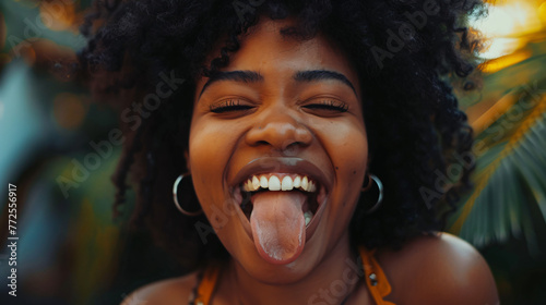 happy black woman sticking tongue out