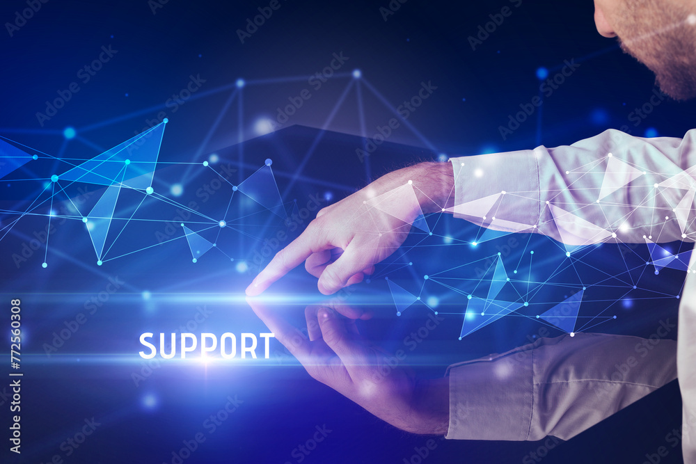 Businessman touching huge screen Businessman touching huge screen