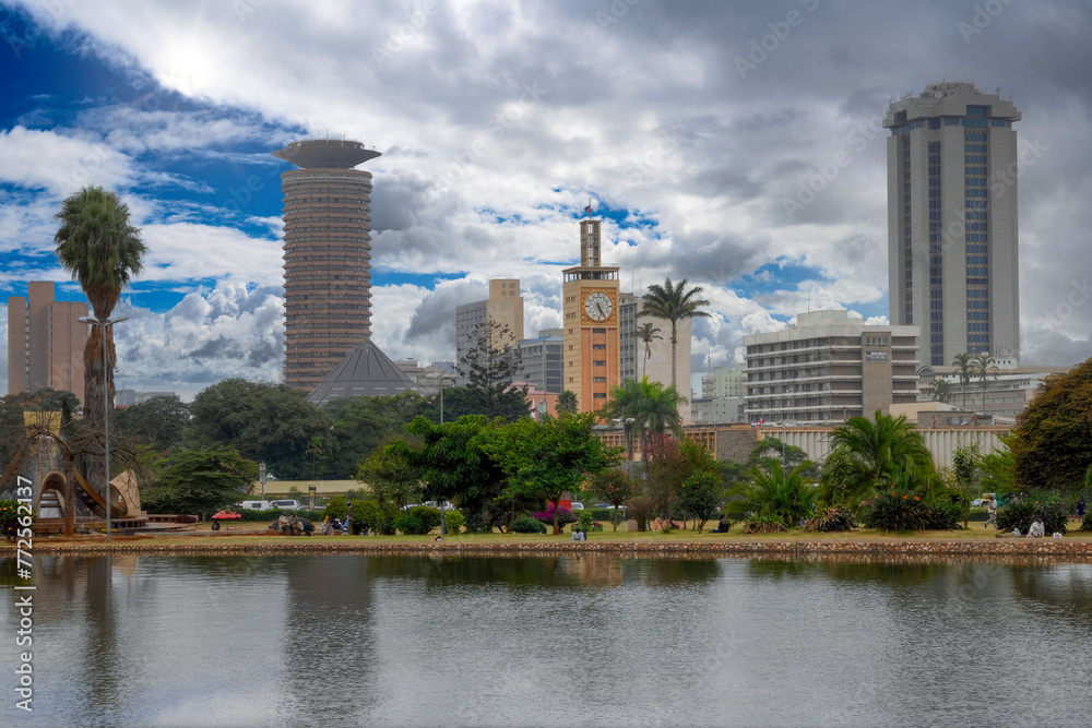 Serene Urban Park in Nairobi, Kenya with KICC Tower, City Hall Clock, and Reflective Lake