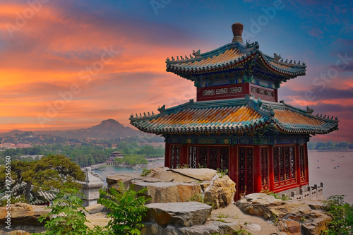 Traditional Chinese Pavilion at Sunrise, with Scenic Lake and Hills photo