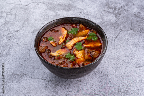 Tom Yum soup with shrimp on a gray background